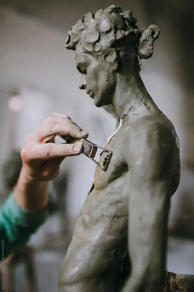 _Hands Of Sculptor Mold Clay Statue_ by Stocksy Contributor _Sergey Narevskih_